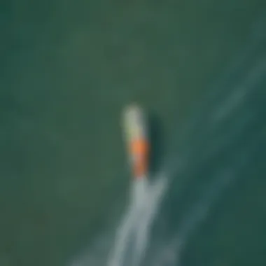 An aerial view of kite surfers gliding over the waters of Kihei