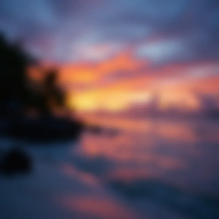 A breathtaking view of White Beach at sunset, showcasing the vibrant colors of the sky reflecting on the calm waters.