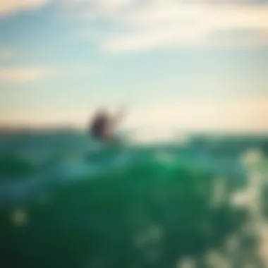 A kiteboarder gliding across the waves of Buzzards Bay