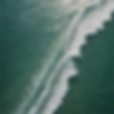 Aerial view of Coconut Bay Beach showcasing kiteboarders riding the waves