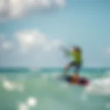 A scenic view of Coconut Bay capturing vibrant kiteboarding action against a clear blue sky.