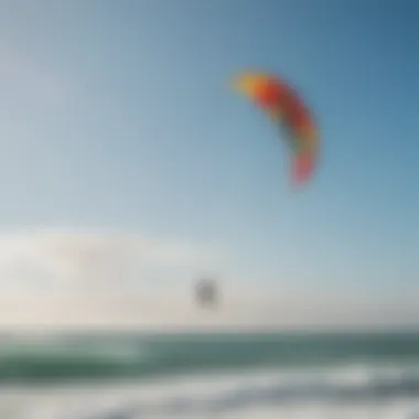 A vibrant kiteboarding session on a sunny beach showcasing colorful kites soaring against a clear blue sky