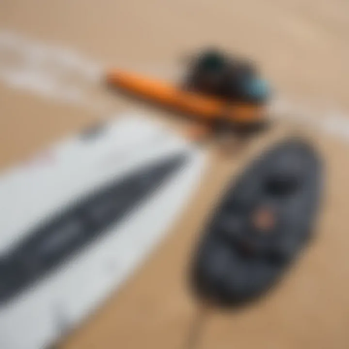 Close-up of high-quality kitesurfing gear laid out on a sandy beach