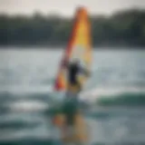 A beginner practicing wing foiling on calm waters