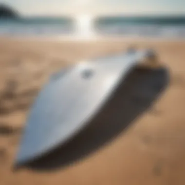 Close-up of wing foil equipment on a sandy beach