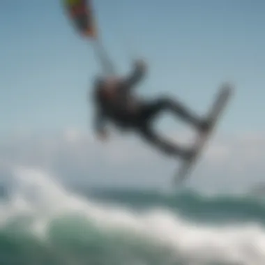 A stunning kiteboarding action shot showcasing a rider in mid-air above the ocean waves.