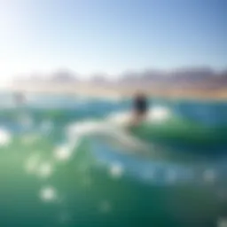 A stunning view of Dolphin Beach with kiteboarders riding the waves
