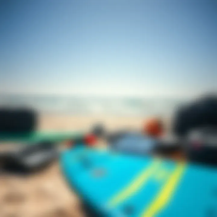 Essential kiteboarding gear laid out on the beach.