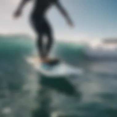 Electric foil surfboard cutting through waves