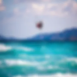Kiteboarder in flight over crystal clear waters