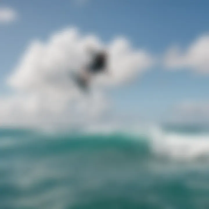 Kiteboarder executing a jump against the backdrop of Aruba's coastline