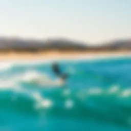 Kiteboarding at a sunny beach with clear skies