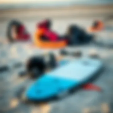 A display of essential kitesurfing equipment laid out on the sand
