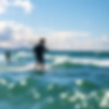 A scenic view of a kiteboarding spot with enthusiasts using electric foil boards.