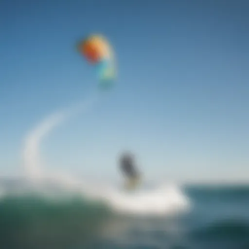 A vibrant North Kitesurf kite soaring high against a clear blue sky