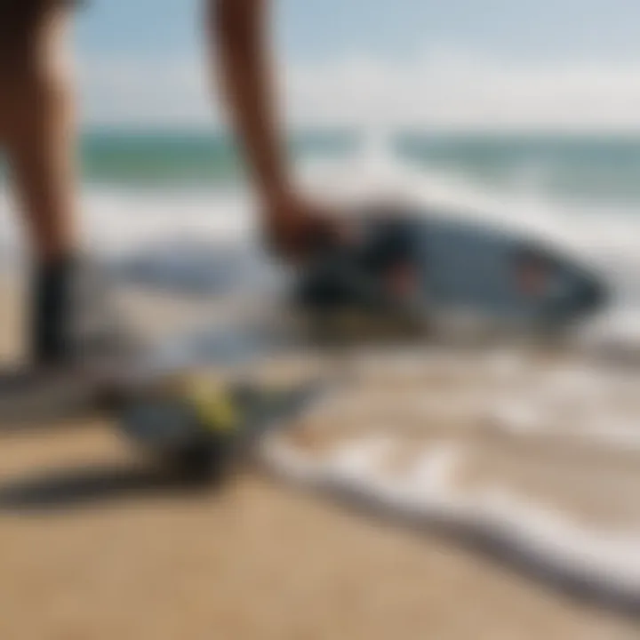 A close-up of a kiteboarder preparing their gear on the sandy shore of Pelican Bay.