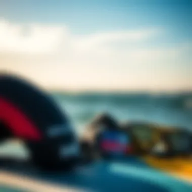 Close-up of kiteboarding gear set against vibrant ocean backdrop
