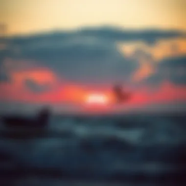 A tranquil sunset over the ocean with kiteboarding silhouettes