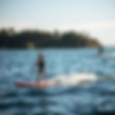 Beginner practicing hydrofoiling techniques on calm water