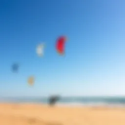 A vibrant kiteboarding scene at Tarifa beach with colorful kites soaring in the sky.