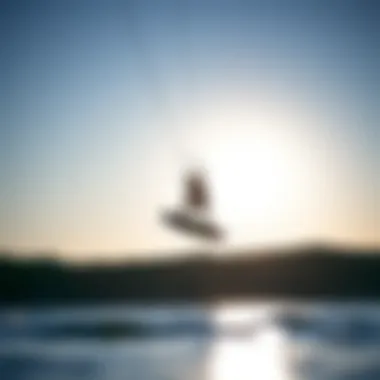 A kiteboarder elegantly maneuvering over water using a hydrofoil board kit, highlighting dynamic performance.
