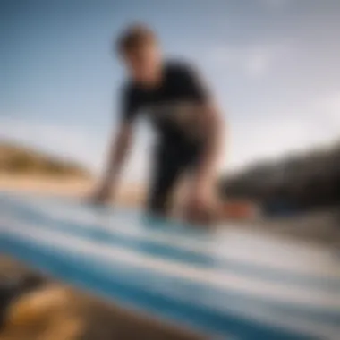 An expert inspecting the material quality of a second-hand kitesurf board