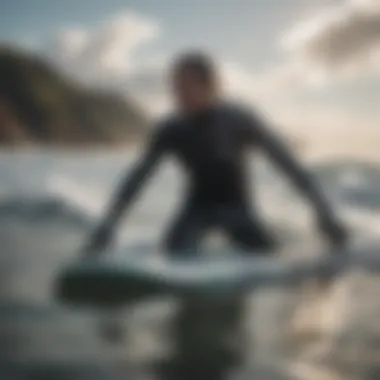 A surfer enjoying a ride in cold waters with gloves on