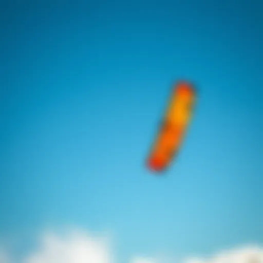 Vibrant kite soaring across the clear blue sky during a kiteboarding session