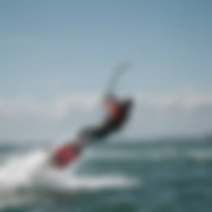 Kiteboarder using Fone carbon mast in action on the water.