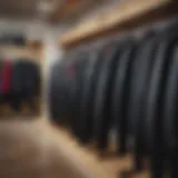 Different types of wetsuits displayed on a rack