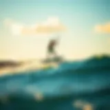 A hydrofoil kitesurfer gliding above the water