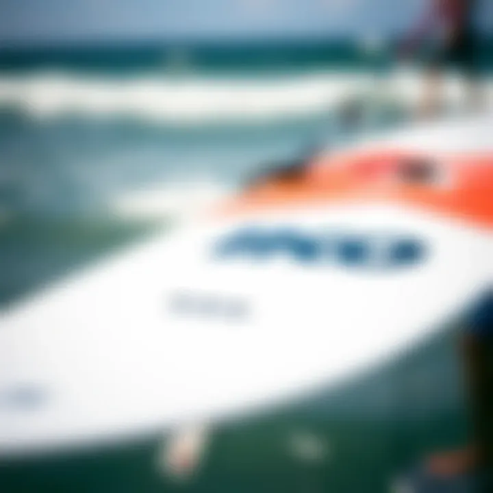 A close-up of a kiteboard with the IKO logo prominently displayed