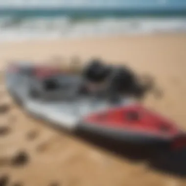 A close-up of essential kite surfing gear laid out on the sand, showcasing the equipment needed for successful lessons.