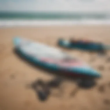 Close-up of kite surfing equipment laid out on the beach