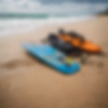 Close-up of kiteboarding gear laid out on the sandy beach