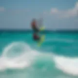 Aerial view of kiteboarders gliding over turquoise waters