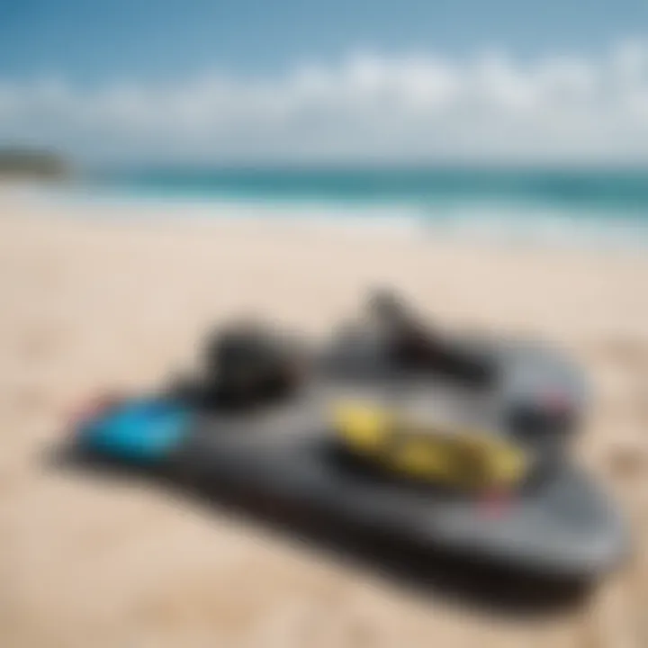 Kiteboarding gear laid out on a sandy beach