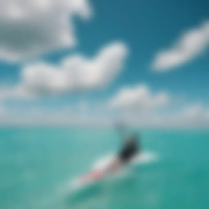 A kiteboarder gliding over turquoise waters under a clear sky