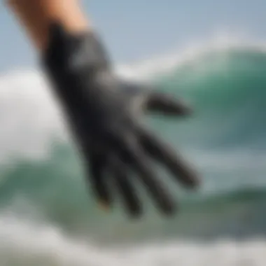 Kitesurf gloves being worn while riding the waves