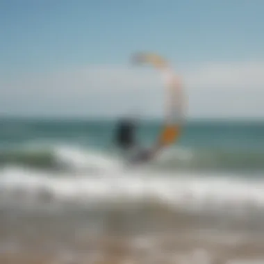 Kitesurfing techniques being demonstrated on the beach