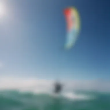 A vibrant kite soaring high against a clear blue sky.