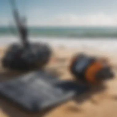 Close-up of essential kitesurfing gear laid out on a sandy beach