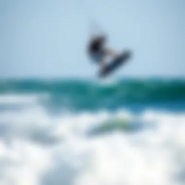 Kiteboarder Jumping Waves Kiteboarder performing a thrilling jump over the waves