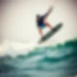 Kiteboarder performing a high jump over the waves