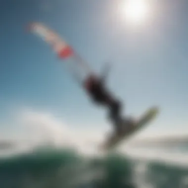 A view of a kiteboarder taking off into the air