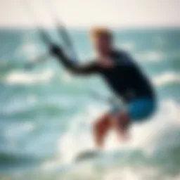 Kiteboarder wearing thin neoprene gloves while riding waves