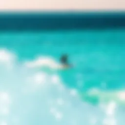 Kiteboarder gliding over turquoise waters