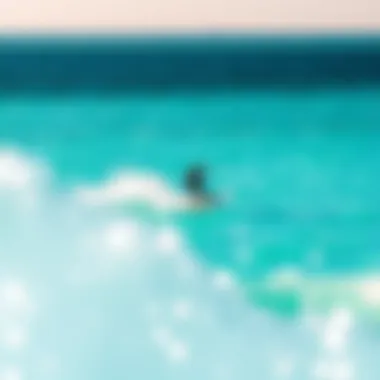 Kiteboarding in turquoise waters of Turks and Caicos Kiteboarder gliding over turquoise waters