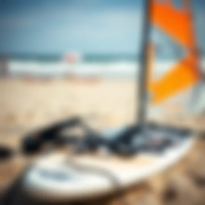 Essential Equipment: A Windsurferโs Gear Close-up view of windsurfing gear, including a board, sail, and harness laid out on the sandy beach