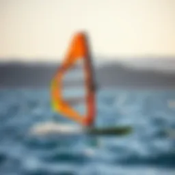 High-performance windsurfing hydrofoil poised on water